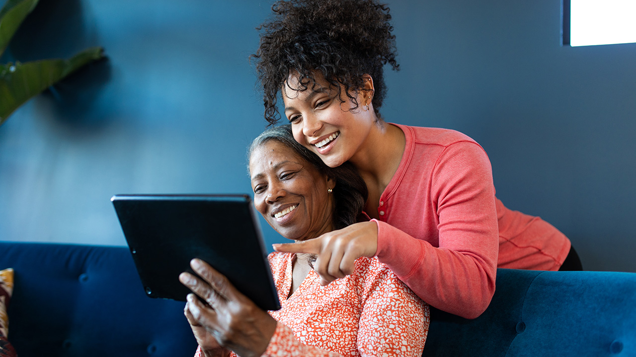 Mother and daughter looking at a tablet